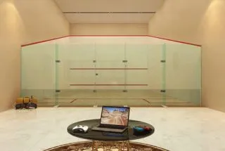 Living room with orange sofa and wooden partition